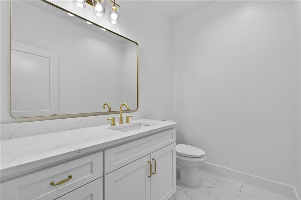 88 Carolyn Path Rockmart, GA 30153 - Photo 24 of 73 a bathroom with a toilet a sink and mirror
