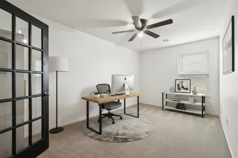 a workspace with furniture and window