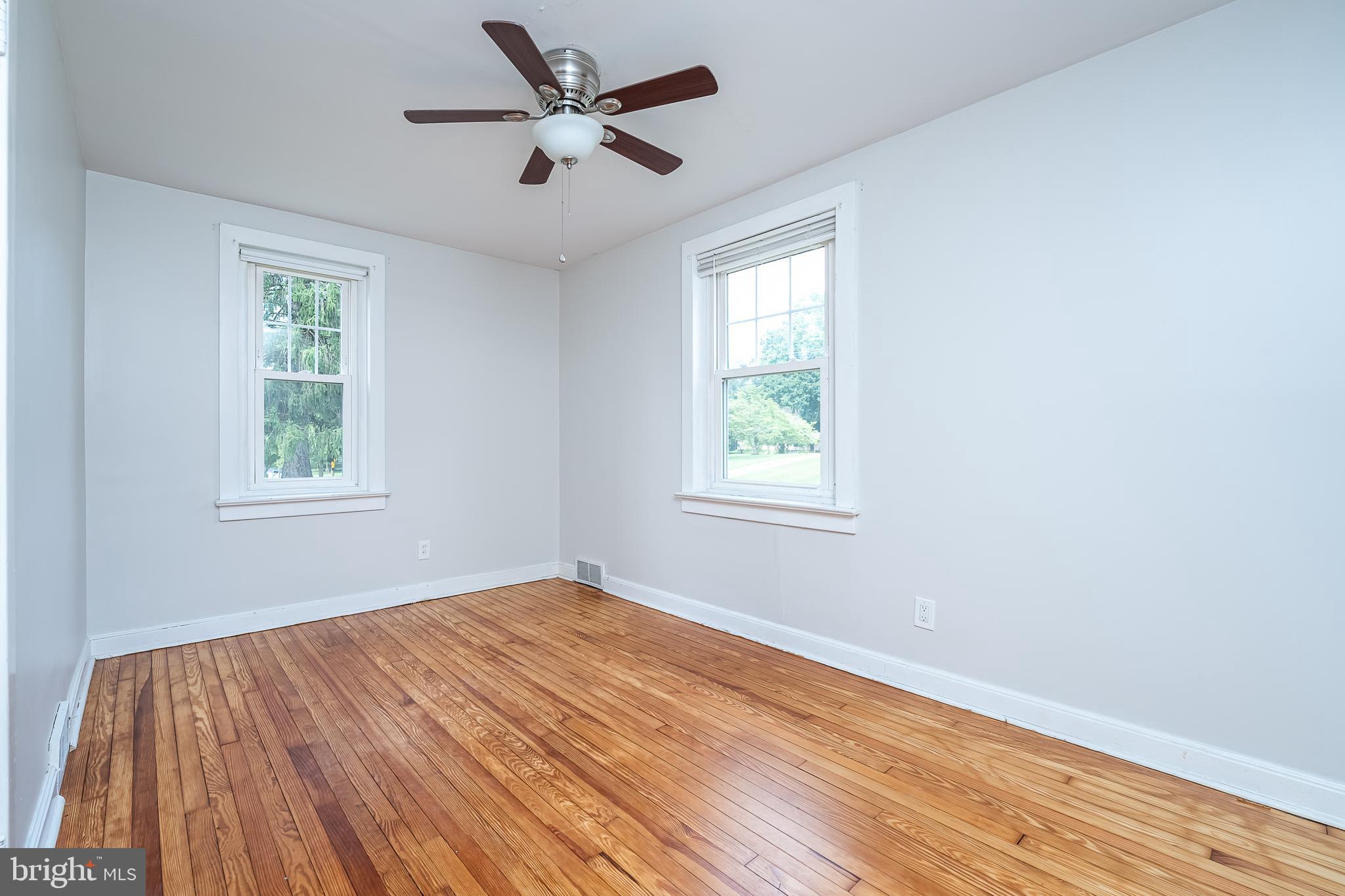 442 Saylors Mill Road Spring City, PA 19475 - Photo 15 of 26 a view of an empty room with wooden floor and a window