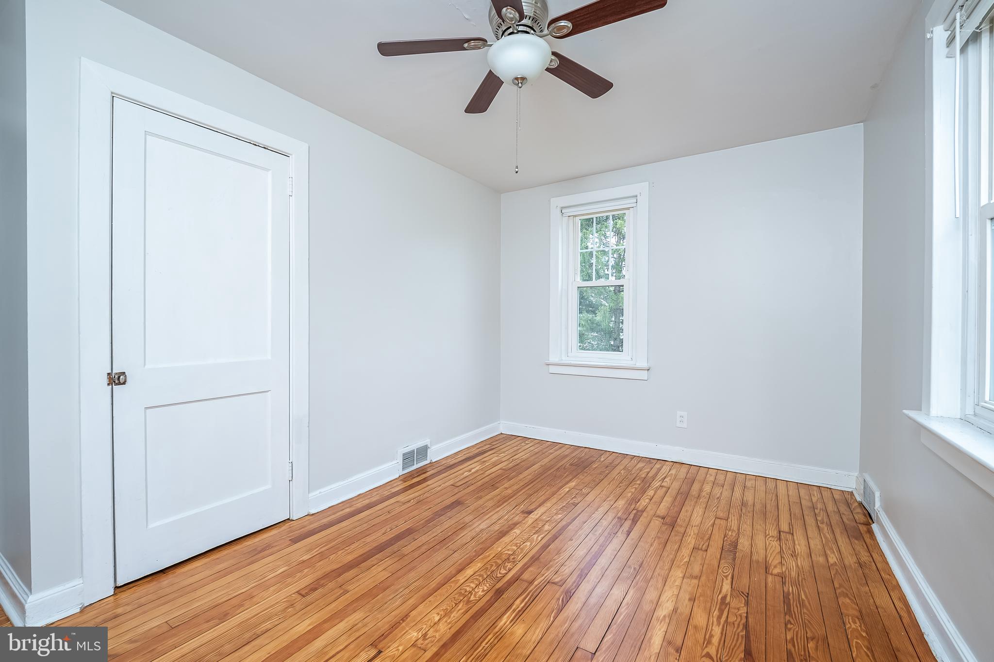 442 Saylors Mill Road Spring City, PA 19475 - Photo 16 of 26 a view of empty room with wooden floor and fan