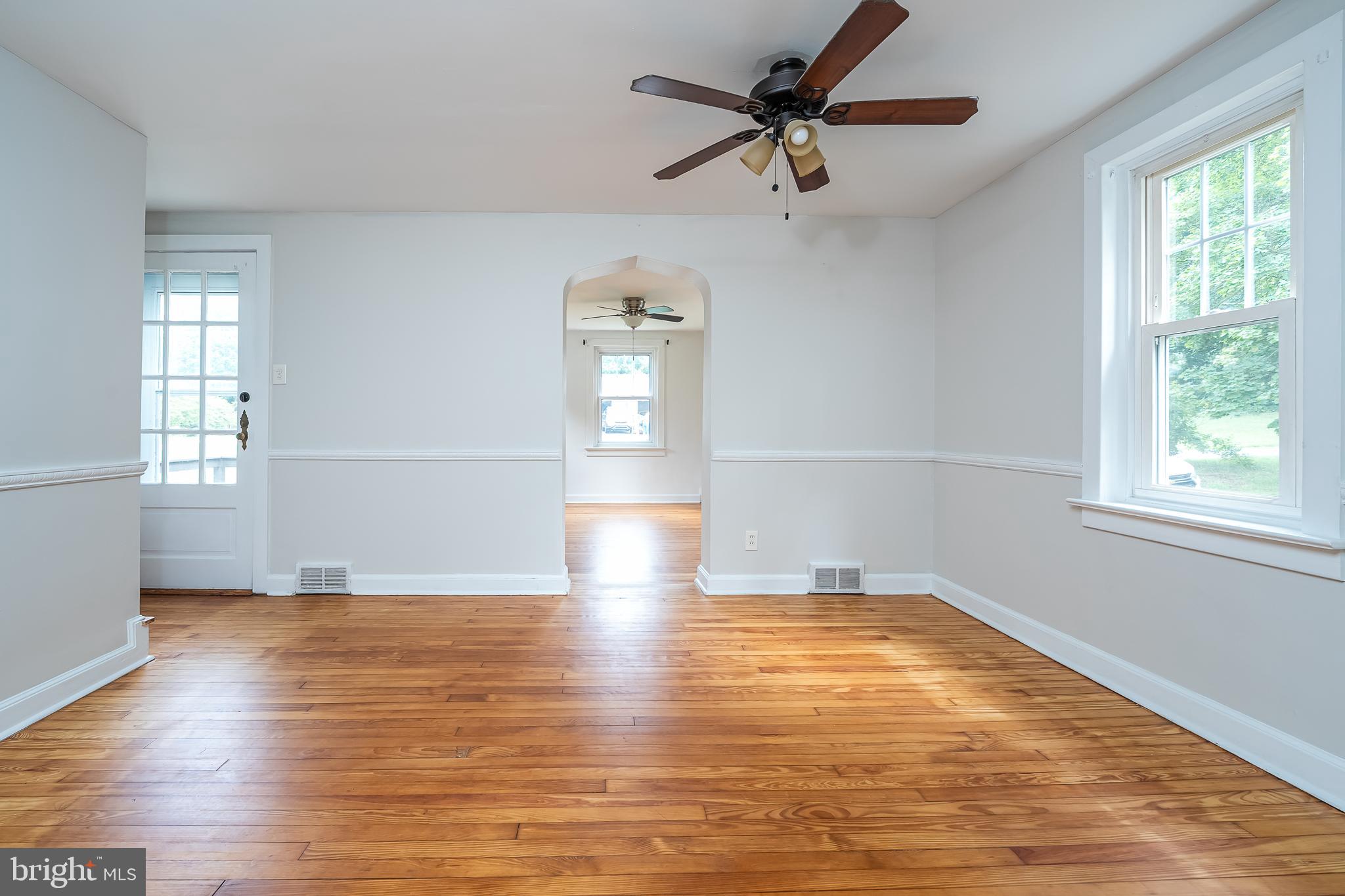 442 Saylors Mill Road Spring City, PA 19475 - Photo 3 of 26 wooden floor in an empty room with a window