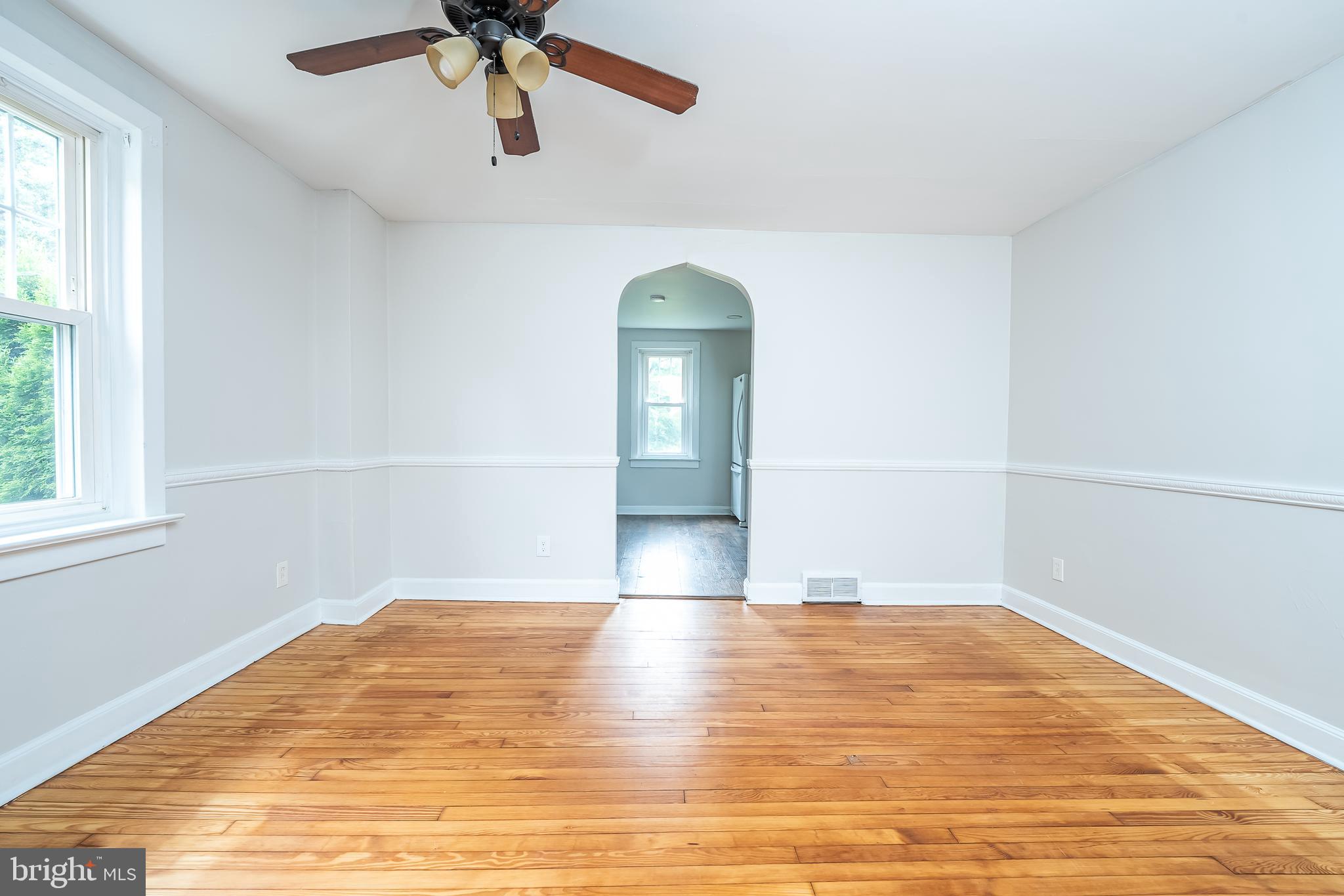 442 Saylors Mill Road Spring City, PA 19475 - Photo 5 of 26 a view of empty room with wooden floor and fan