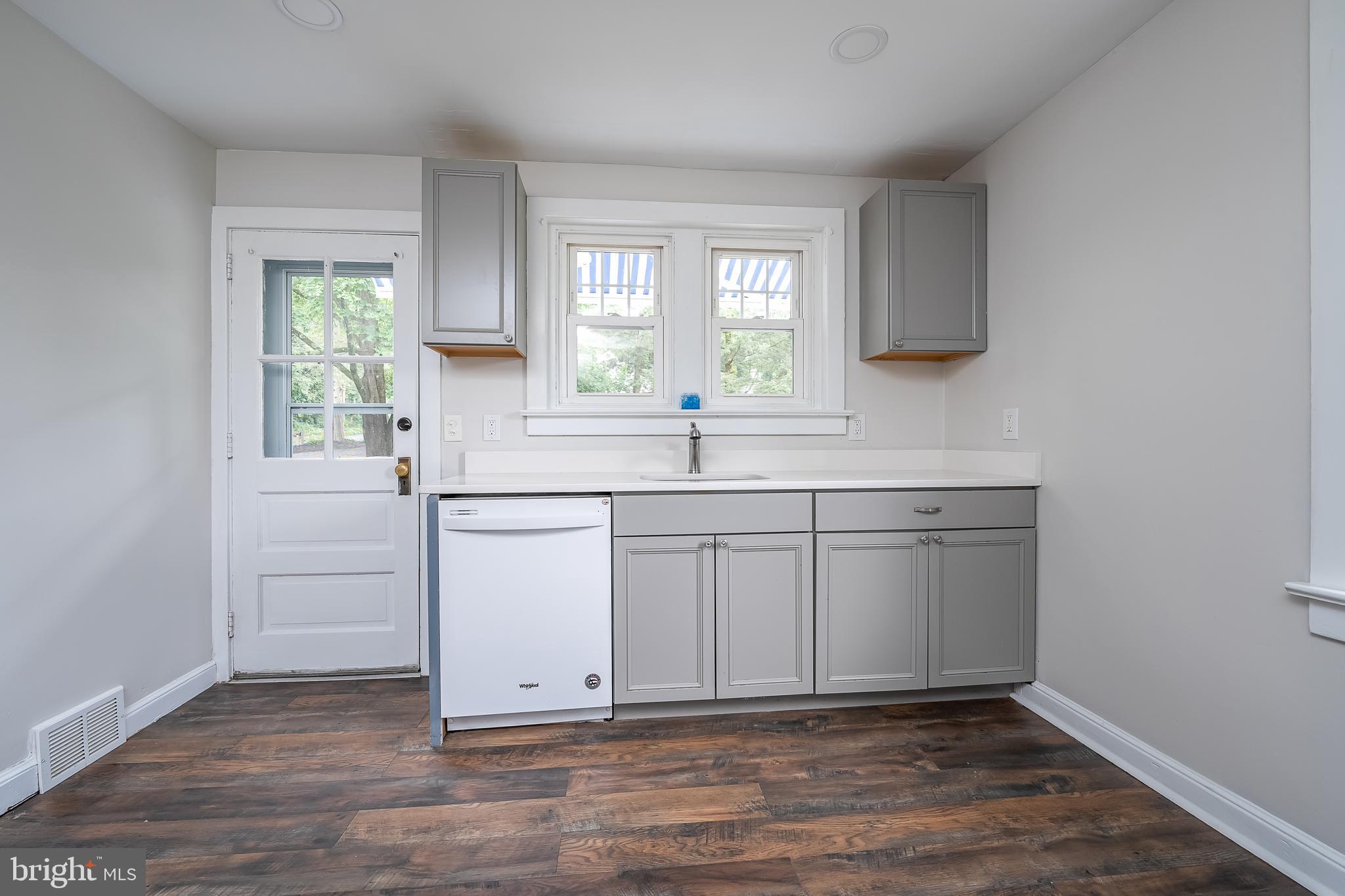 442 Saylors Mill Road Spring City, PA 19475 - Photo 8 of 26 a kitchen with white cabinets and window