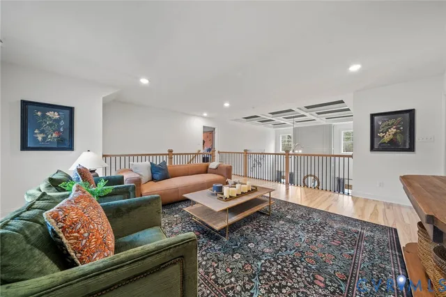 a living room with furniture and a rug