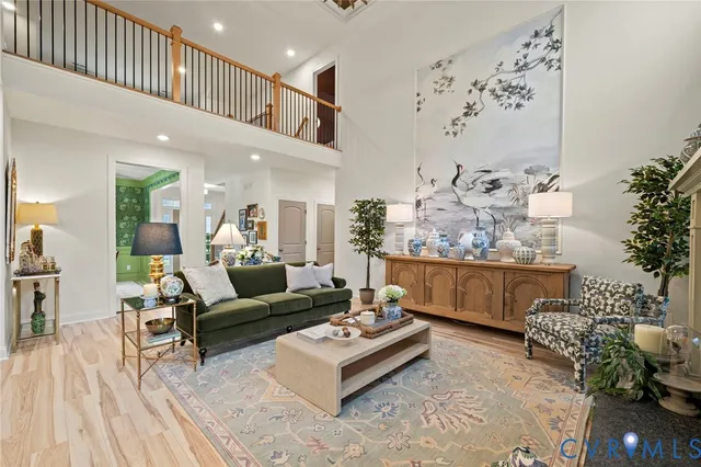 a living room with furniture and flowers