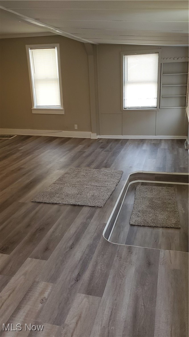 17610 Brazil Road Cleveland, OH 44119 - Photo 16 of 50 Spare room featuring a healthy amount of sunlight and wood-type flooring