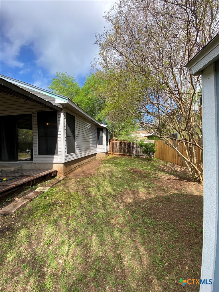 8305 Fort Sumter Road Austin, TX 78745 - Photo 12 of 23 a front view of a house with a garden
