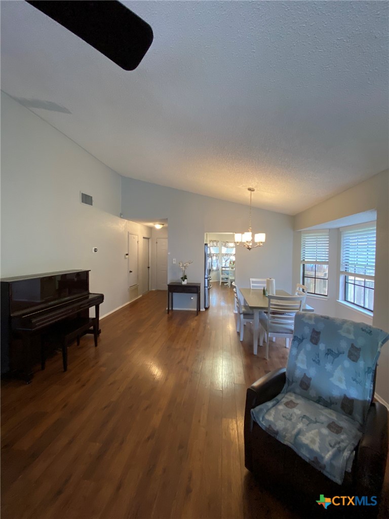 8305 Fort Sumter Road Austin, TX 78745 - Photo 15 of 23 a living room with furniture and a piano