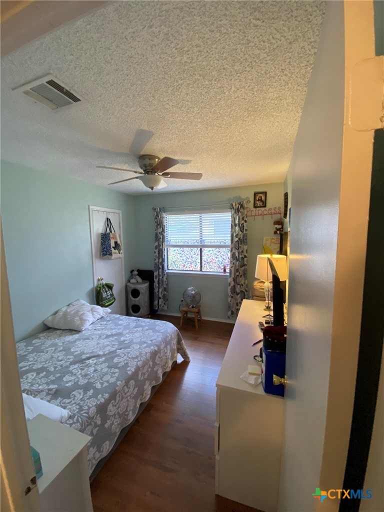 8305 Fort Sumter Road Austin, TX 78745 - Photo 21 of 23 a bedroom with a bed and window