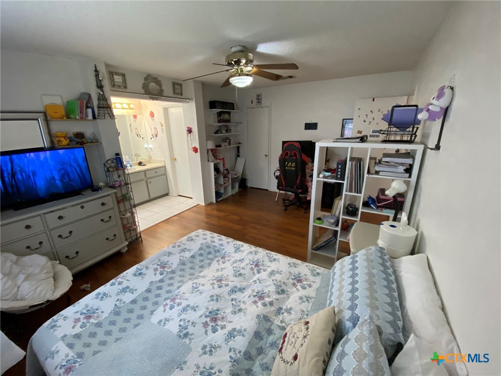 8305 Fort Sumter Road Austin, TX 78745 - Photo 22 of 23 a living room with furniture and wooden floor