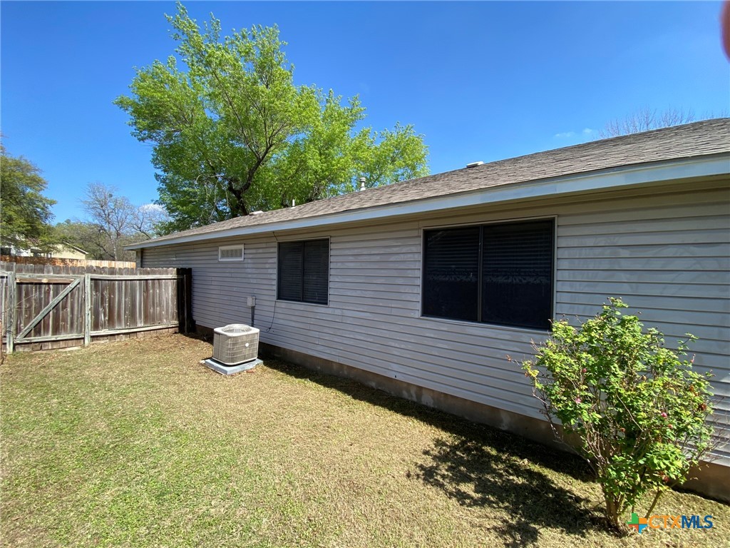 8305 Fort Sumter Road Austin, TX 78745 - Photo 3 of 23 a view of a house with backyard and sitting area
