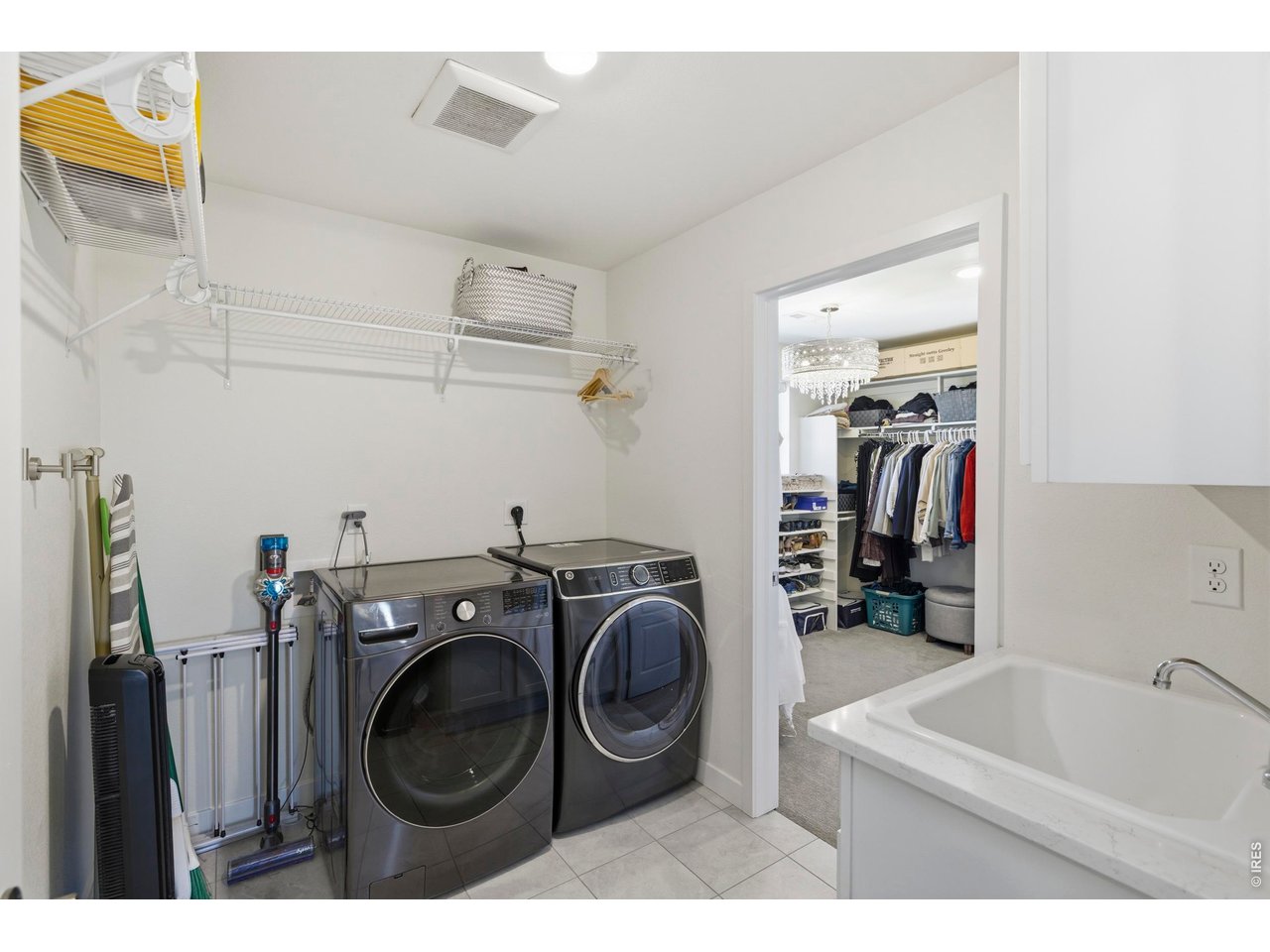 2910 Water View Street Timnath, CO 80547 - Photo 27 of 50 a utility room with sink dryer and washer