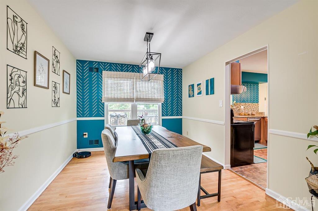 127 Hickory Road Somerset, NJ 08873 - Photo 14 of 51 a view of a dining room with furniture and wooden floor