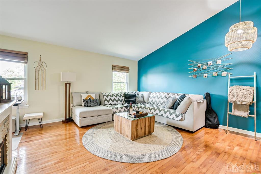 127 Hickory Road Somerset, NJ 08873 - Photo 23 of 51 a living room with furniture and a chandelier