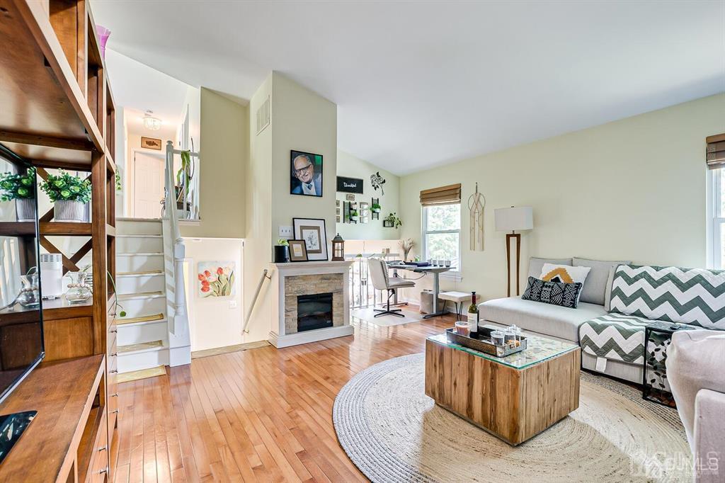 127 Hickory Road Somerset, NJ 08873 - Photo 24 of 51 a living room with furniture and a fireplace