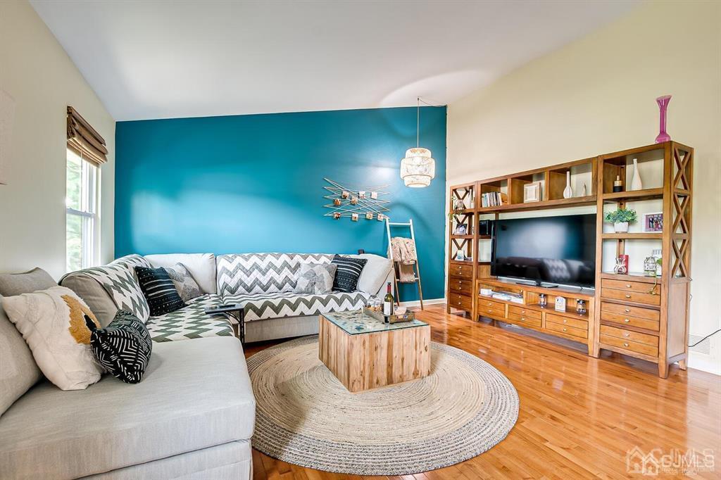 127 Hickory Road Somerset, NJ 08873 - Photo 25 of 51 a living room with furniture and a flat screen tv