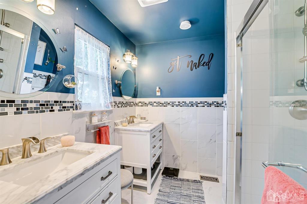 127 Hickory Road Somerset, NJ 08873 - Photo 36 of 51 a bathroom with a sink and a mirror