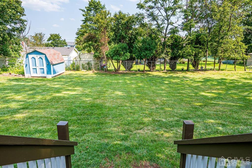 127 Hickory Road Somerset, NJ 08873 - Photo 47 of 51 a view of a garden with a bench