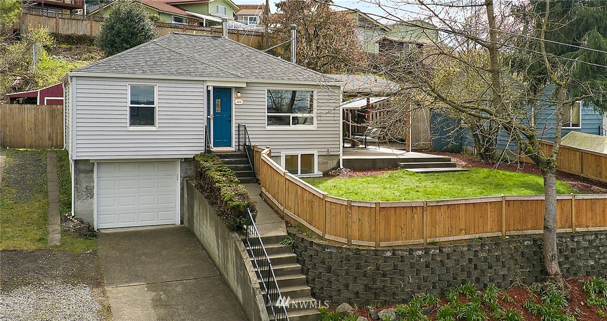 466 Grandey Way Northeast Renton, WA 98056 - Photo 1 of 21 a view of a house with a wooden fence
