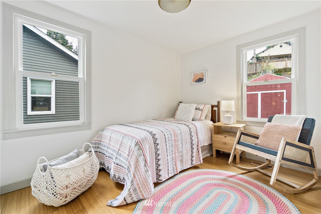 466 Grandey Way Northeast Renton, WA 98056 - Photo 11 of 21 a bedroom with a bed and wooden floor