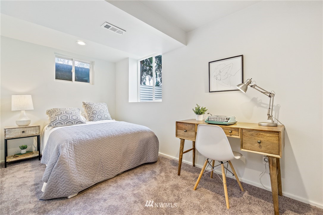 466 Grandey Way Northeast Renton, WA 98056 - Photo 13 of 21 a bedroom with a bed and a table in it