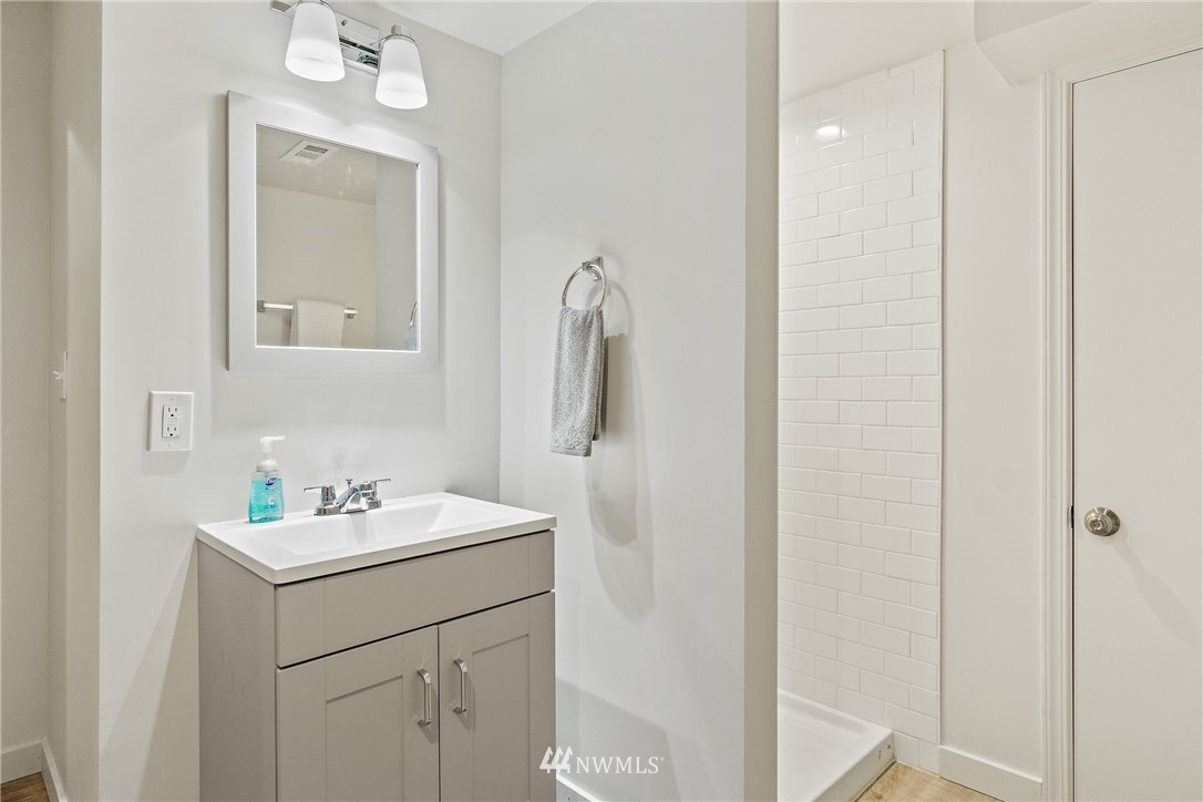 466 Grandey Way Northeast Renton, WA 98056 - Photo 14 of 21 a bathroom with a sink mirror and vanity