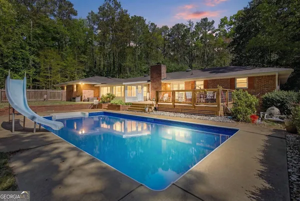 a view of a swimming pool with a patio