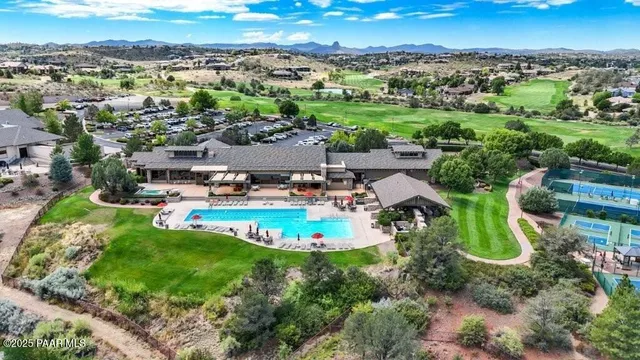 an aerial view of a garden with mountains
