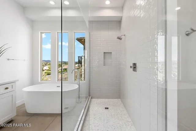 a bathroom with a glass shower door