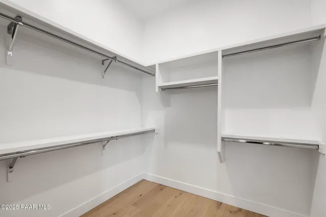 a view of an empty walk in closet