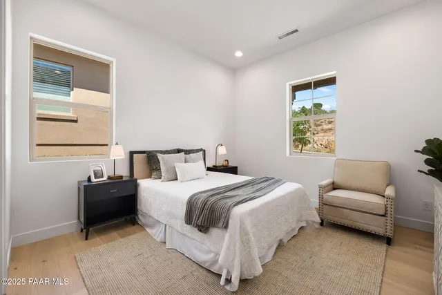 a bedroom with a bed and a couch