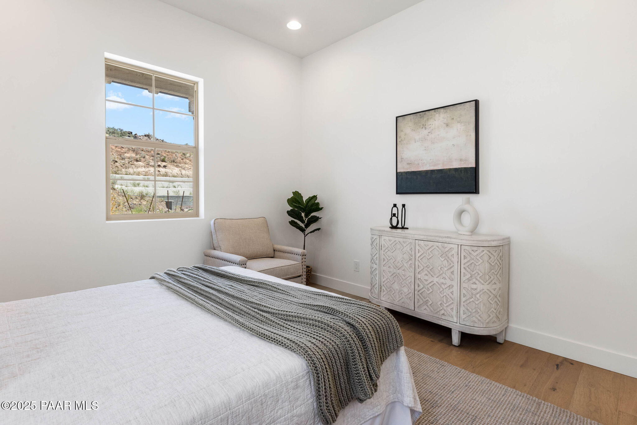 1109 South Lakeview Drive Prescott, AZ 86301 - Photo 37 of 48 a bedroom with a bed a mirror and a window