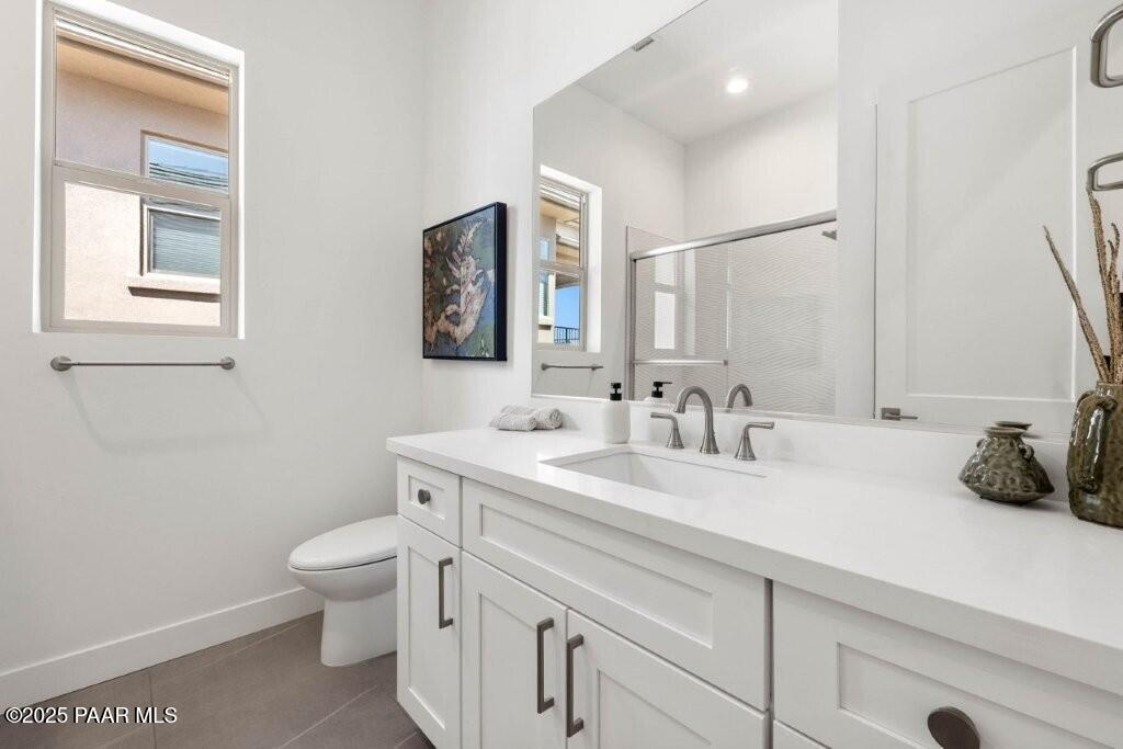 1109 South Lakeview Drive Prescott, AZ 86301 - Photo 38 of 48 a bathroom with a toilet a sink and mirror