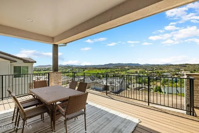 a view of a balcony with lake view and mountain view