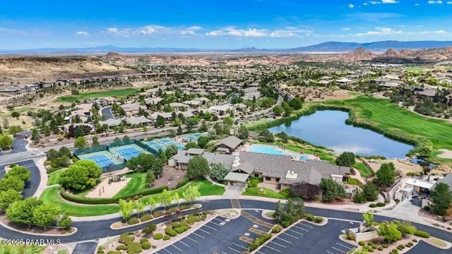 an aerial view of residential houses with outdoor space and street view