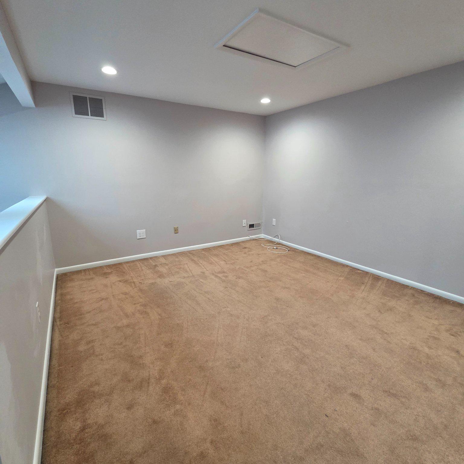 208 Ashley Run Voorhees, NJ 08043 - Photo 4 of 23 an empty room with a workbench