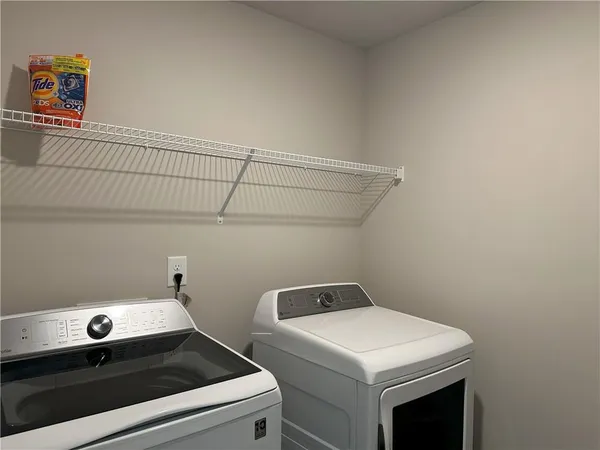 a utility room with dryer and washer