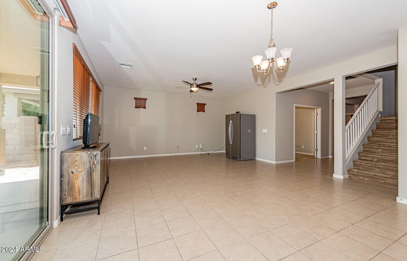 2729 East Dunbar Drive Phoenix, AZ 85042 - Photo 12 of 29 a view of a livingroom with a chandelier