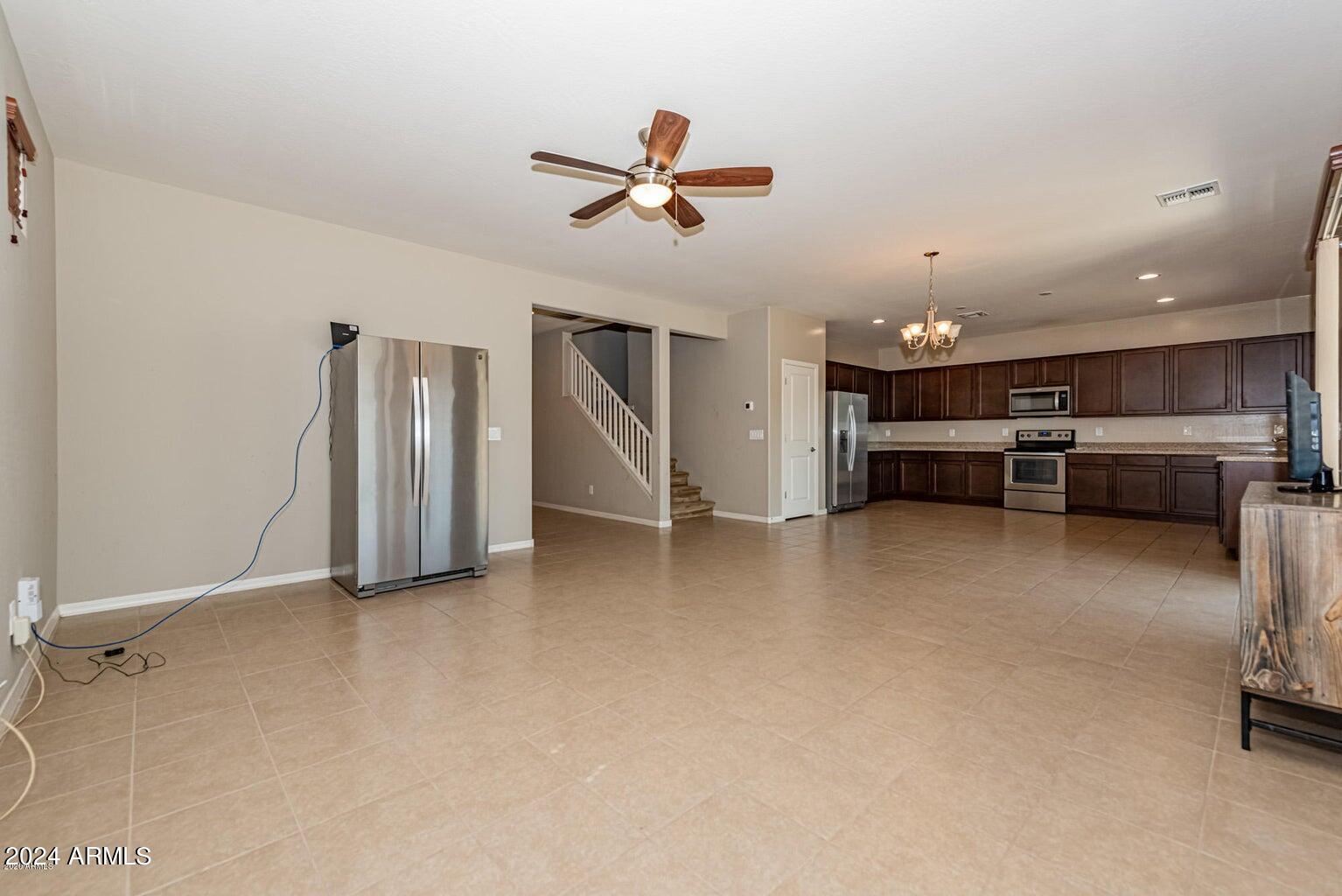 2729 East Dunbar Drive Phoenix, AZ 85042 - Photo 13 of 29 a view of kitchen with furniture and a ceiling fan