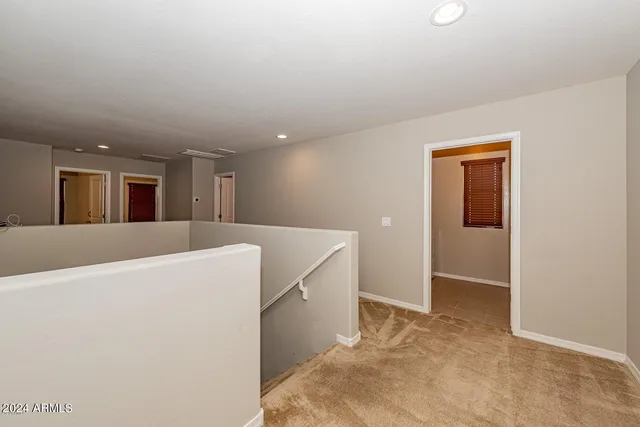 a view of a kitchen with wooden floor and more cabinets