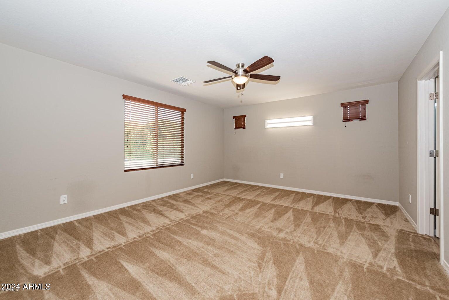 2729 East Dunbar Drive Phoenix, AZ 85042 - Photo 17 of 29 a view of empty room with ceiling fan