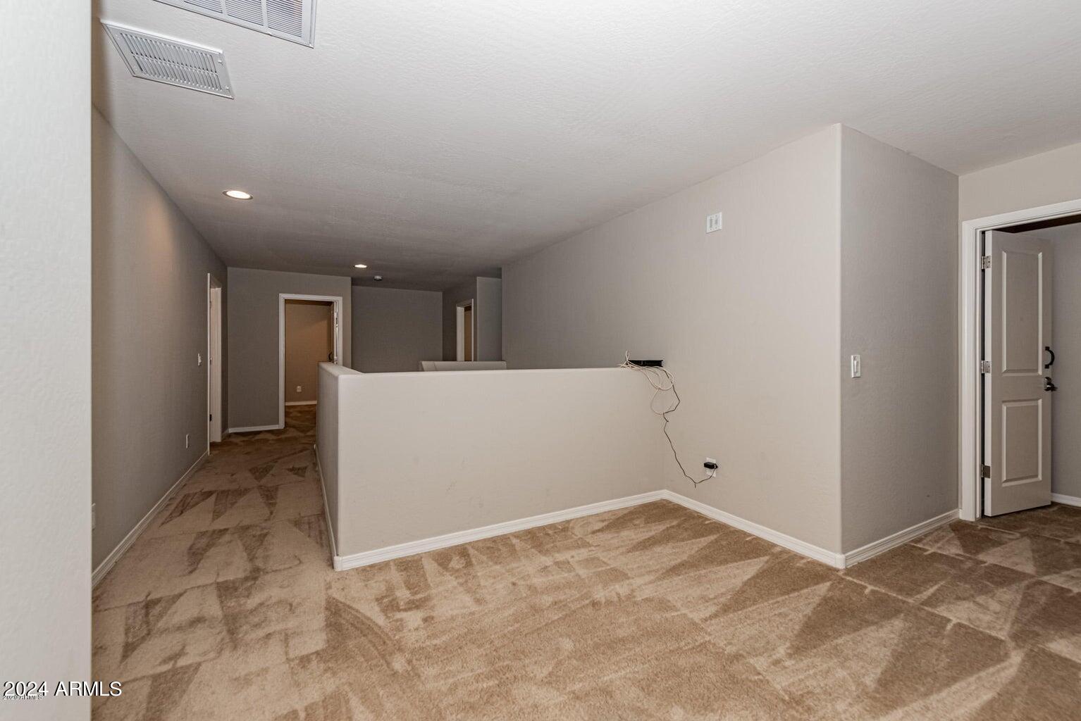 2729 East Dunbar Drive Phoenix, AZ 85042 - Photo 23 of 29 a view of a big room with closet and windows