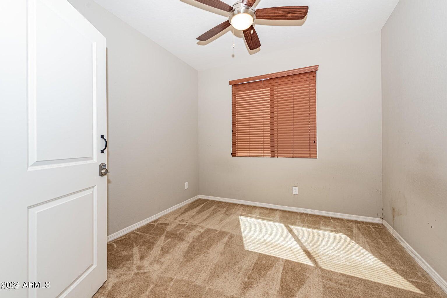 2729 East Dunbar Drive Phoenix, AZ 85042 - Photo 7 of 29 a view of an empty room with a window