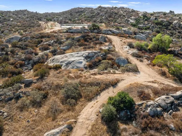 a view of a town with mountains in the background