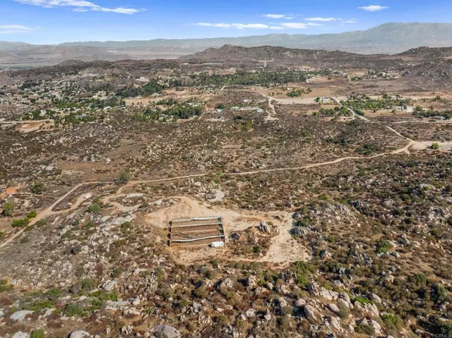 an aerial view of residential house with parking space