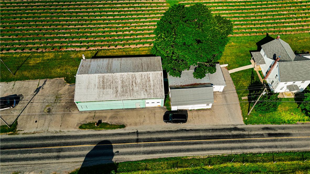 868 Catawissa Road Tamaqua, PA 18252 - Photo 3 of 67 An aerial perspective reveals a rural property, bordered by a long road and green fields.
