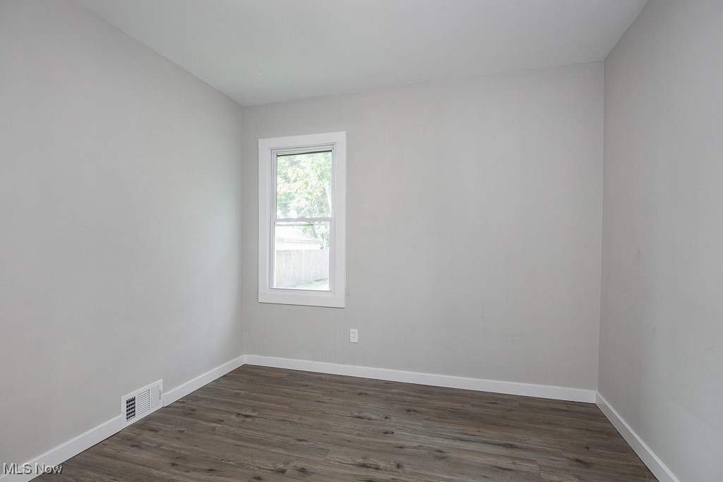 5607 Ridgewood Avenue Parma, OH 44129 - Photo 15 of 23 Spare room with dark hardwood / wood-style floors