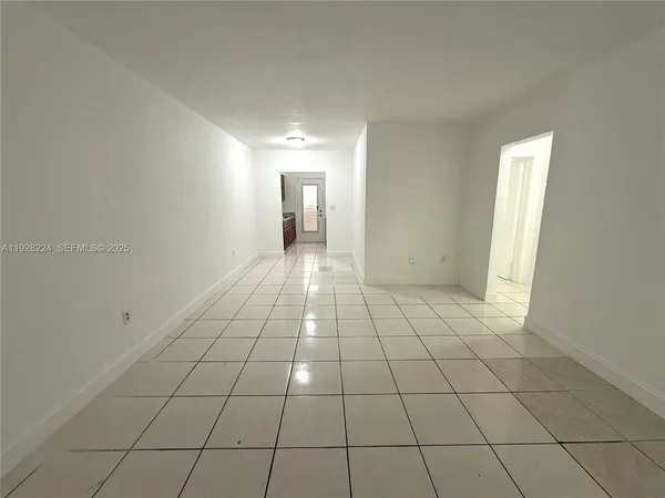 a view of an empty room and window