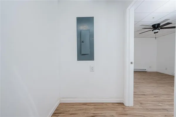 a bathroom with a toilet sink and shower
