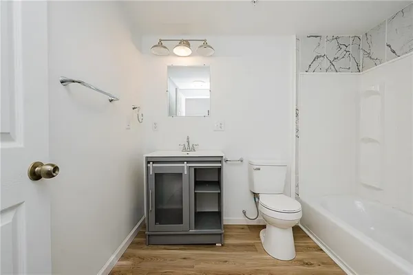 a kitchen with stainless steel appliances granite countertop refrigerator sink and cabinets